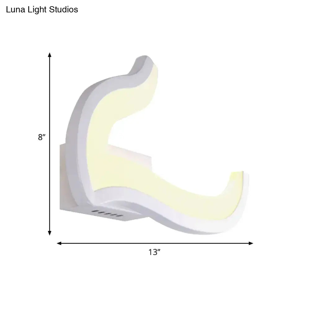 Modern white u-shaped led wall sconce with sleek curved design emitting warm yellow light for bedroom use