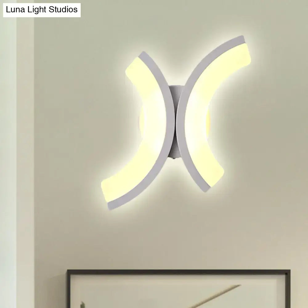 Modern white u-shaped led wall sconce with sleek curved design providing warm and white bedroom lighting