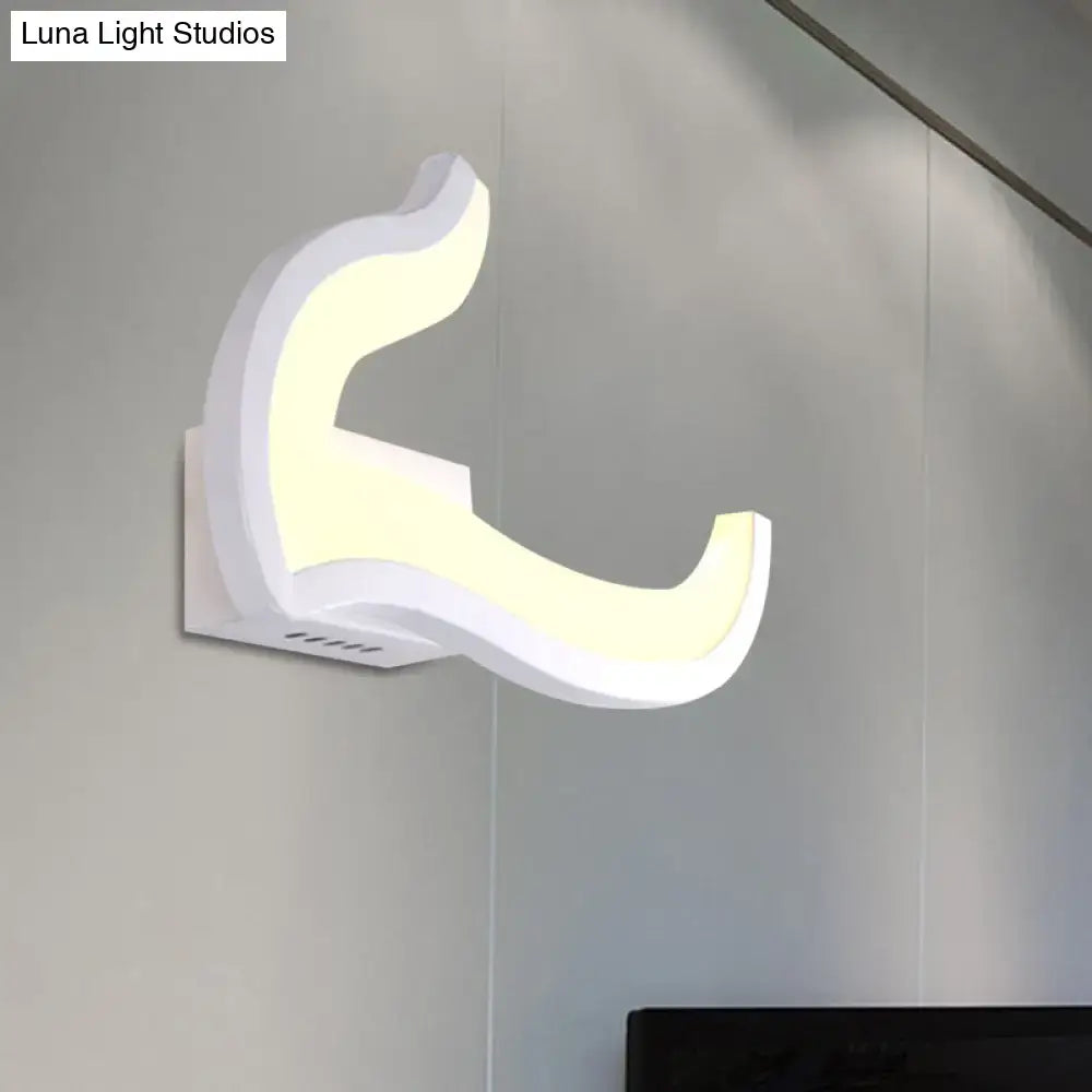 Modern white u-shaped led wall sconce with sleek curved design providing warm and white ambient bedroom lighting