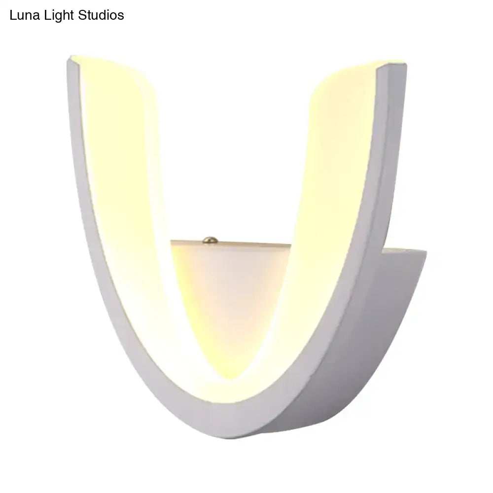 Modern white u-shaped led wall sconce with sleek matte finish and warm yellow lighting for bedroom use