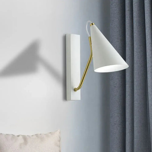 Modern white wall lamp with gold articulated arm and conical sconce design for bedroom lighting with white black accents