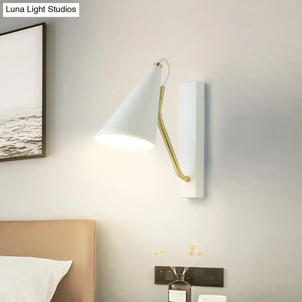 Modern white wall lamp with gold articulated arm featuring a conical white black finish sconce for bedroom use