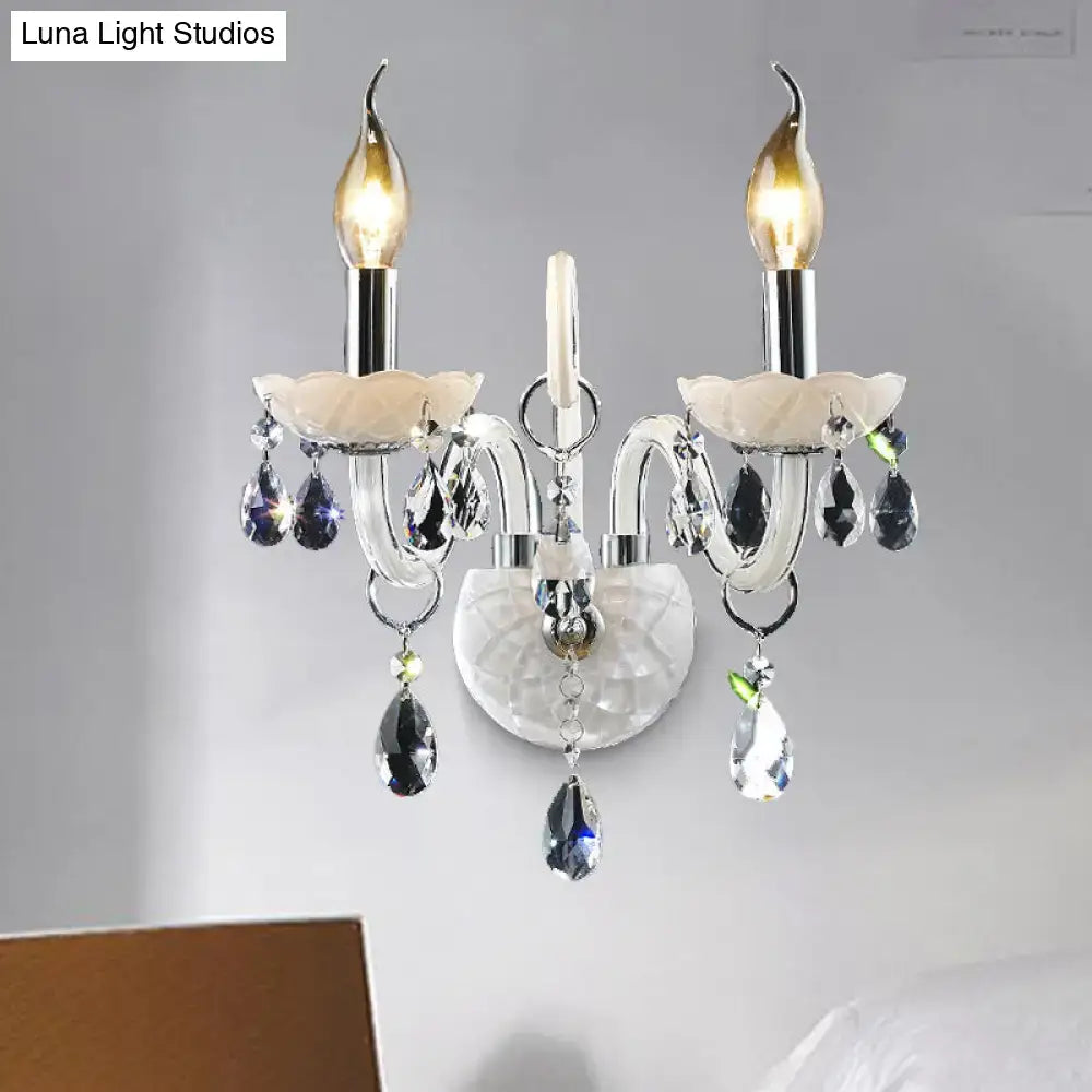 Elegant modern white wall sconce light with chrome arms frosted glass shades and teardrop crystal decoration for living room