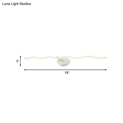 Modern white wave design led vanity light fixture with wavy illuminated pattern and circular base for bathroom use