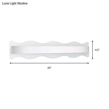 Modern white 20-inch wave led light fixture with sleek finish providing white warm bathroom wall sconce illumination