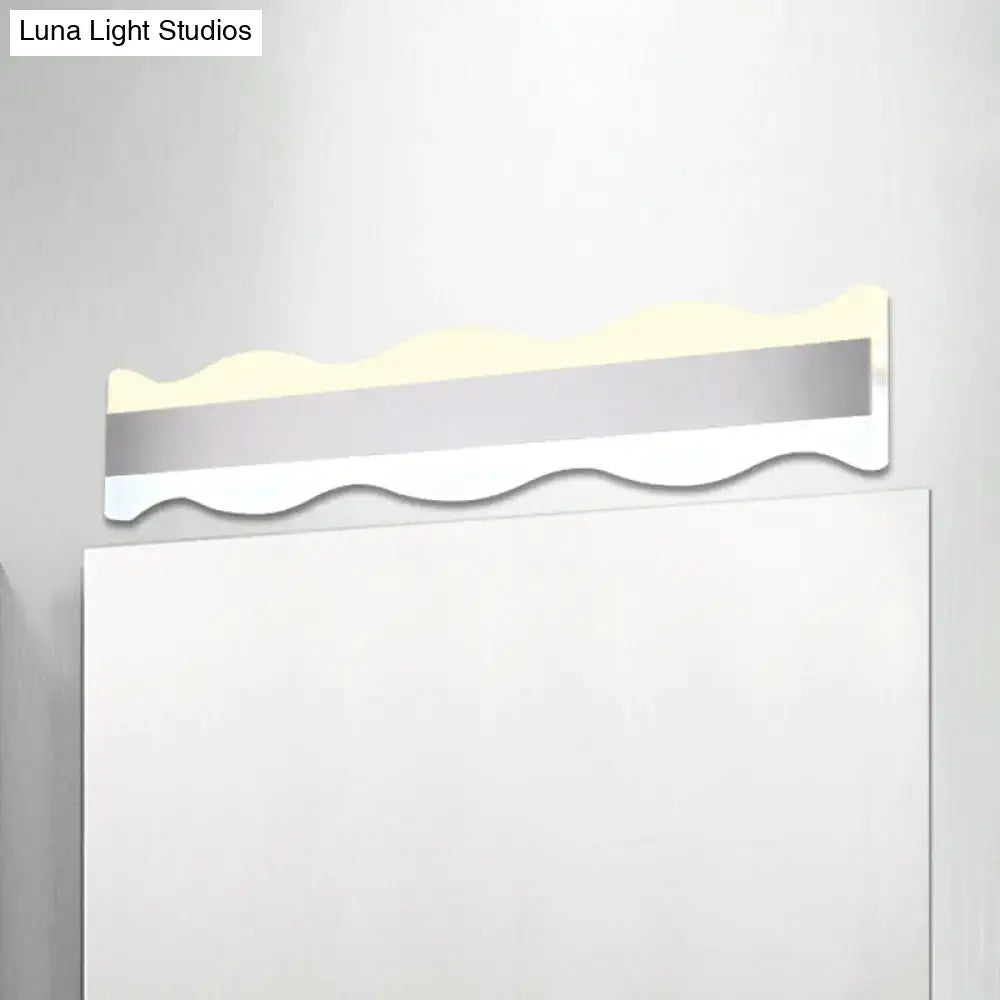 Modern white wave led light fixture with warm white illumination and sleek silver and white design for bathroom use