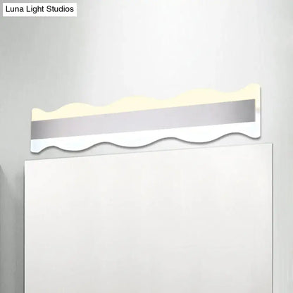 Modern white wave led light fixture with warm white illumination and sleek silver and white design for bathroom use