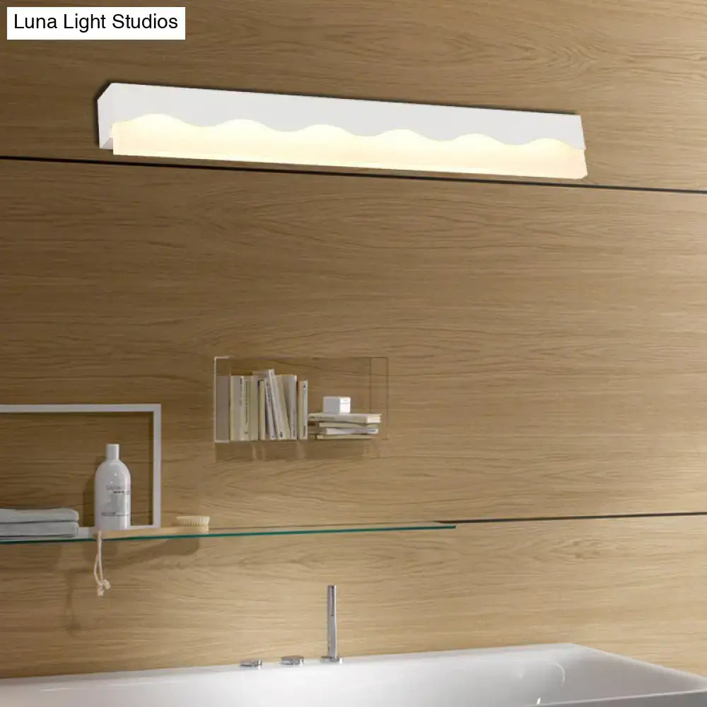 Modern white wave led vanity light fixture with sleek wavy design mounted above bathroom sink wall lamp