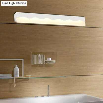 Modern white wave led vanity light fixture with sleek wavy design mounted above bathroom sink wall lamp