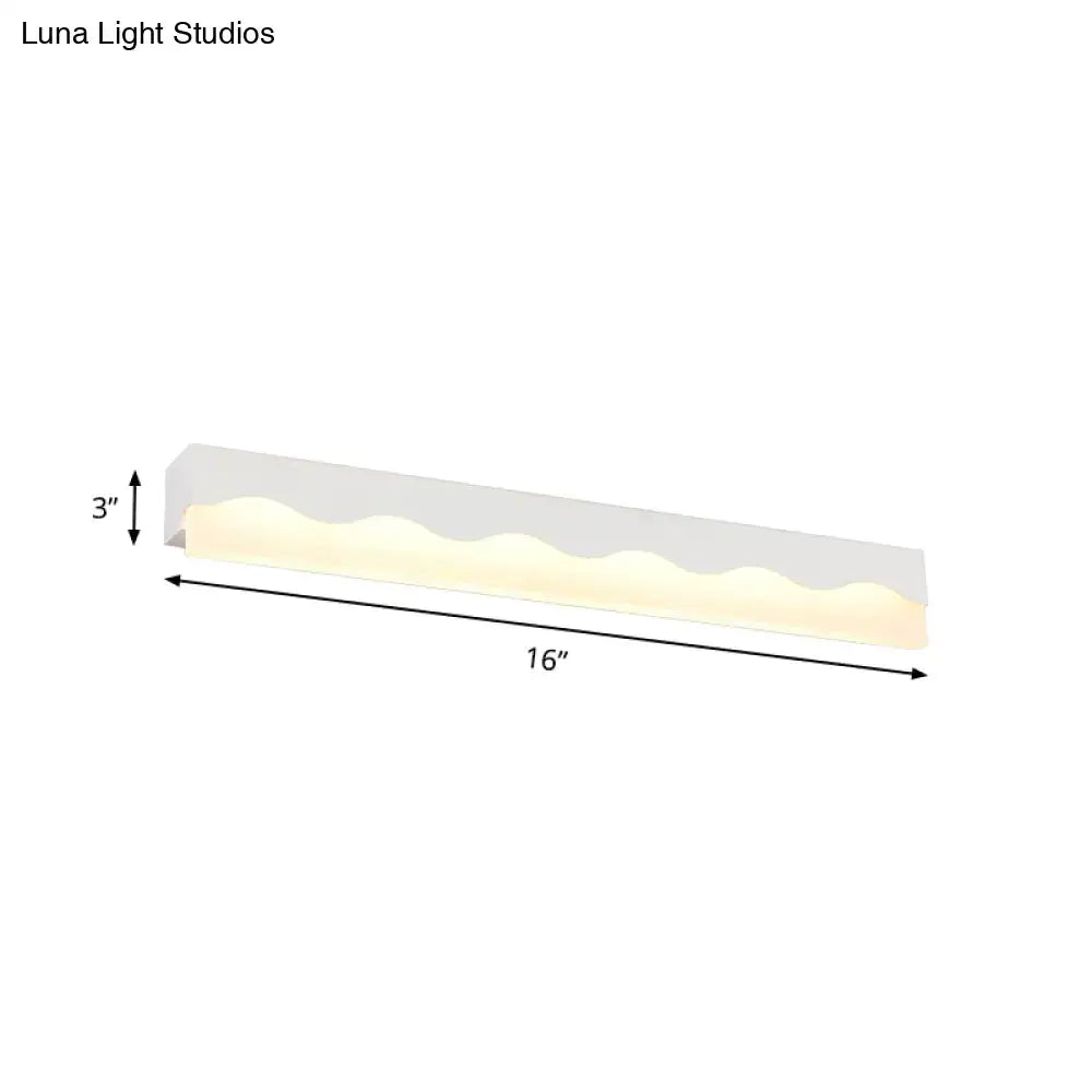 Modern white wave led vanity light fixture with a sleek 16-inch design and warm ambient lighting for bathroom use