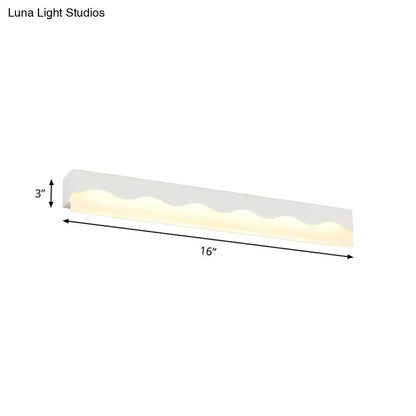 Modern white wave led vanity light fixture with a sleek 16-inch design and warm ambient lighting for bathroom use