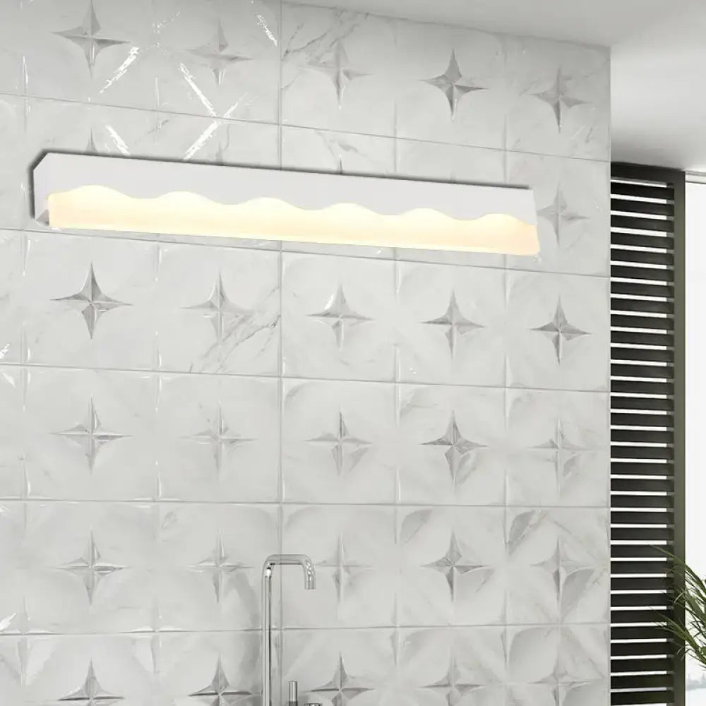 Modern white wave led vanity light fixture with sleek rectangular design and warm-toned led vanity illumination