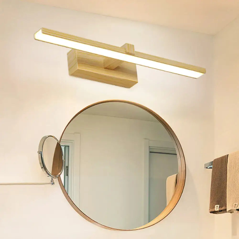 Modern white wood led wall lamp with gold-toned wooden vanity light mounted above a round bathroom mirror