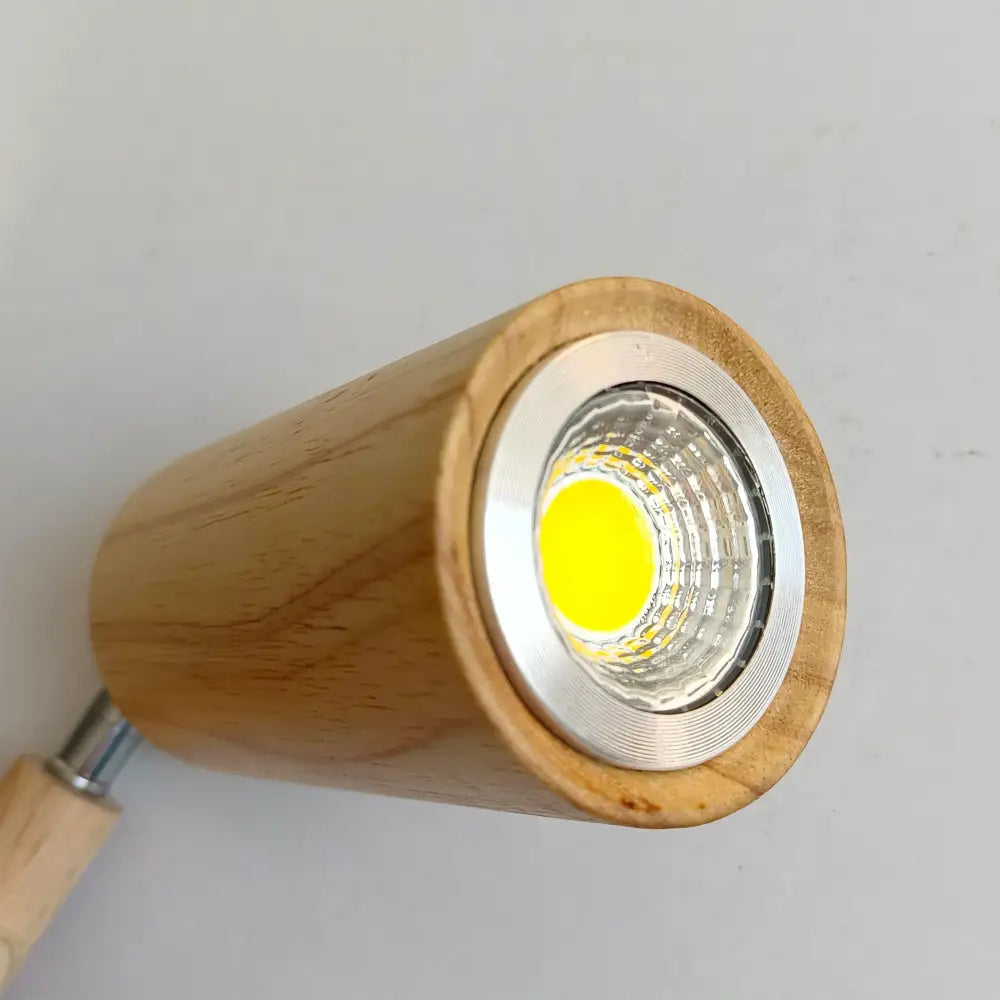Modern wood 4-light led ceiling lamp with cylindrical wooden design and silver rim featuring bright yellow decorbites led ceiling bulb