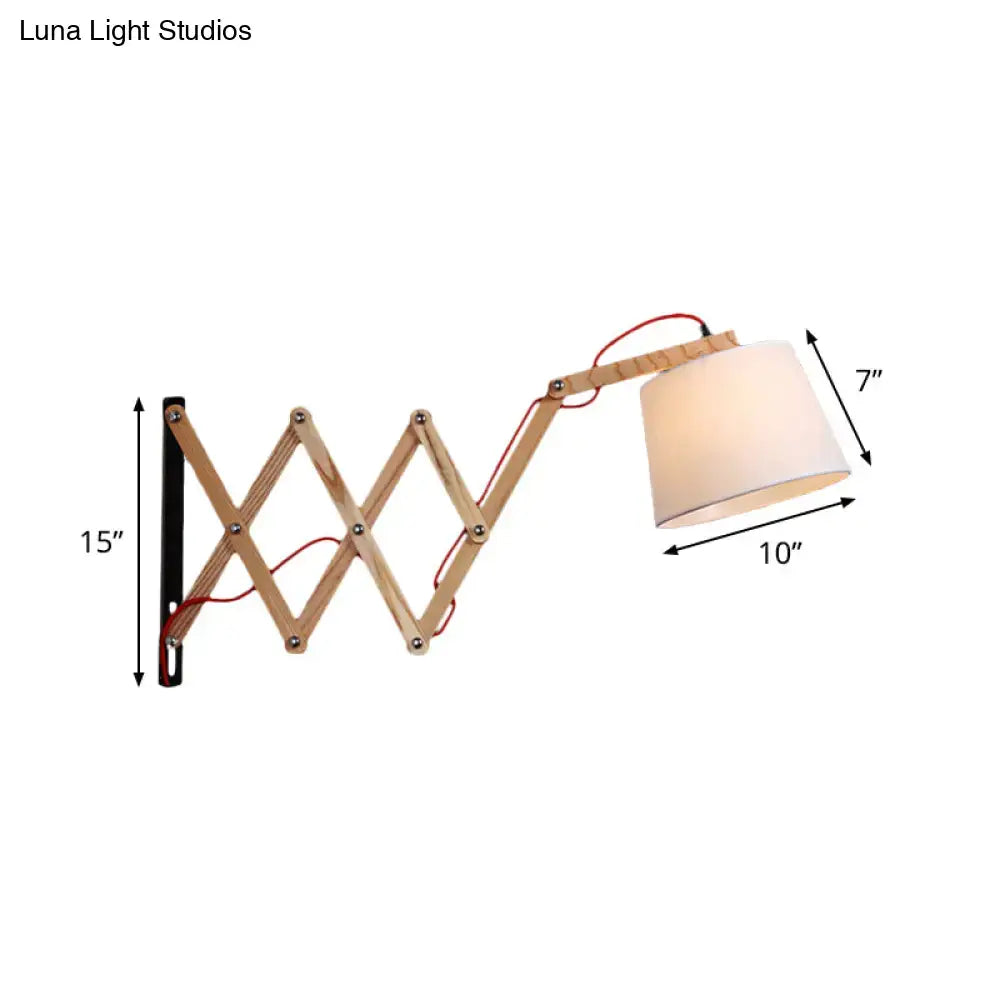Modern wood accordion sconce with white fabric shade and red wiring for bedroom lighting