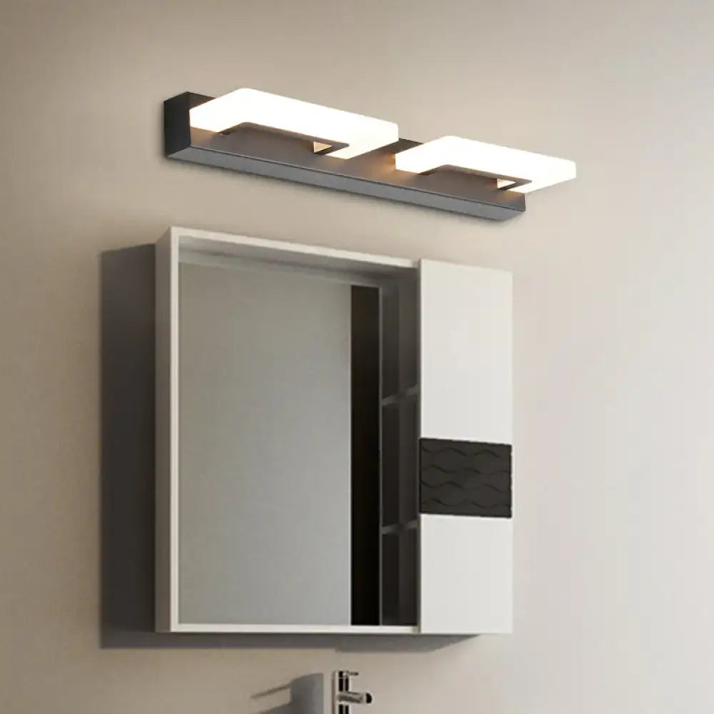 Modern black and white wall lighting featuring a wood and acrylic rectangle vanity sconce with two rectangular led panels