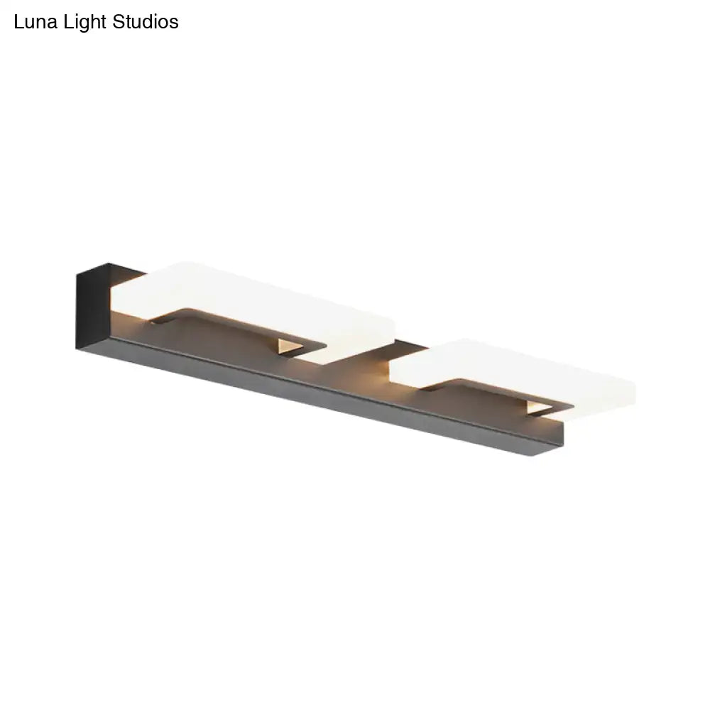 Modern black metal wall lighting with acrylic rectangle vanity sconce featuring two frosted glass panels emitting warm light