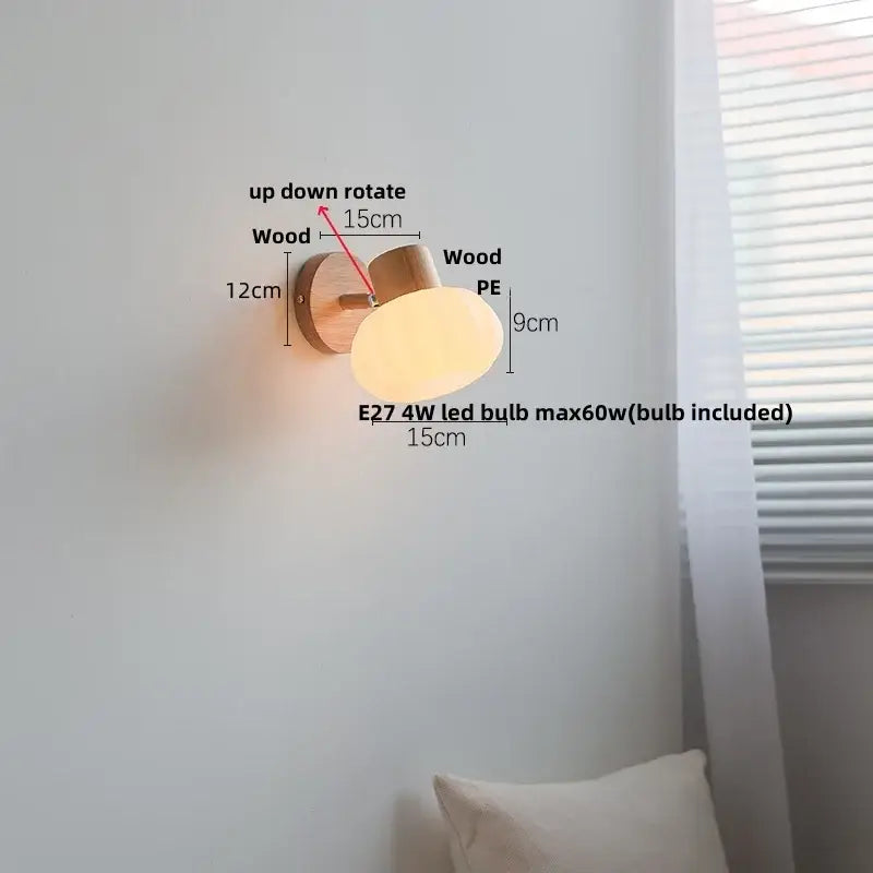 A warm-toned oval wall sconce with natural wood base and amber glass led pull chain for modern decorbites decor