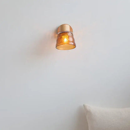 Modern wood and amber glass led wall sconce with warm amber glass and copper finished metal base for bedroom decorbites amber glass