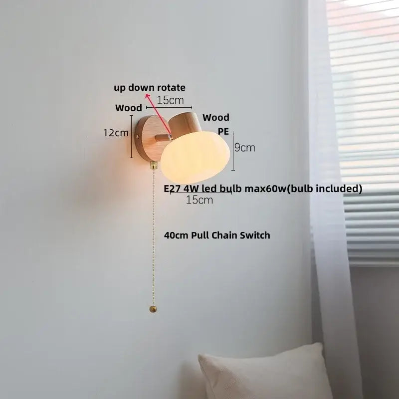 Modern wood and amber glass led wall sconce with warm-toned oval amber glass led and natural wood base decorbites amber glass