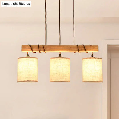 Modern wood and beige fabric island lighting fixture with warm-toned shades and black cords for 220v-240v 110v-120v use