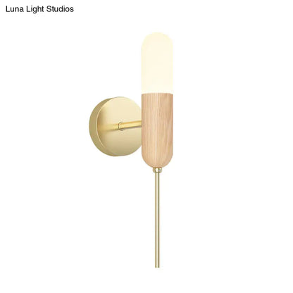 Modern wood and brass led light fixture wall sconce with warm frosted glass shade and brushed brass hardware
