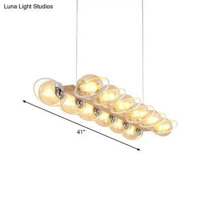 DecorBites™ modern glass hanging light fixture with a wooden base and cognac bubble shade island lighting design