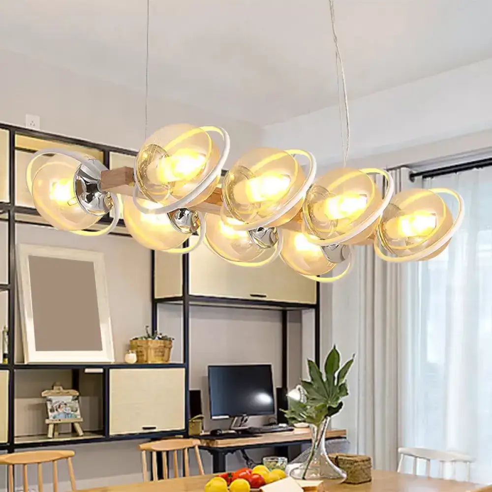 Modern pendant light featuring cognac bubble shade glass and chrome accents for bubble shade island lighting