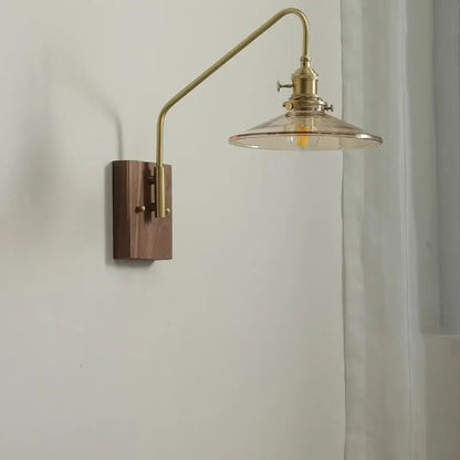 Modern brass-finished wall sconce with wooden base and clear glass shade for bedroom or stair glass copper led wall lighting