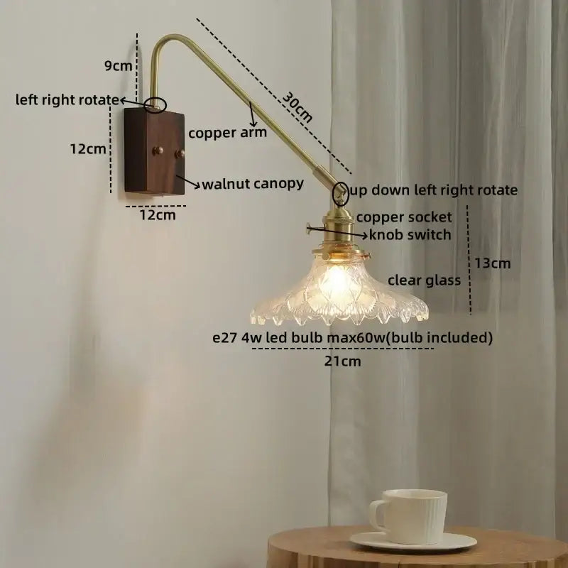 Vintage-style wall sconce with brass copper arm, walnut base, and clear glass copper led shade for bedroom or stairs