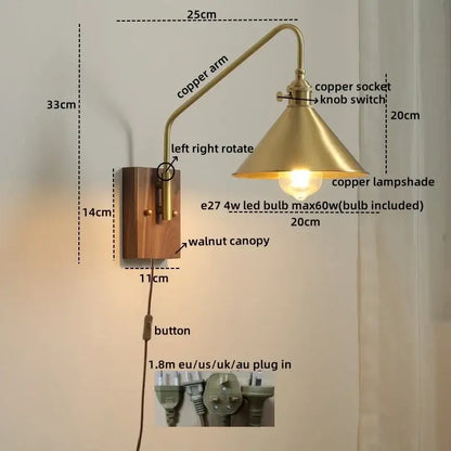 Brass-finished modern wood and copper led wall sconce with curved copper arm and walnut base for bedroom or stair lighting