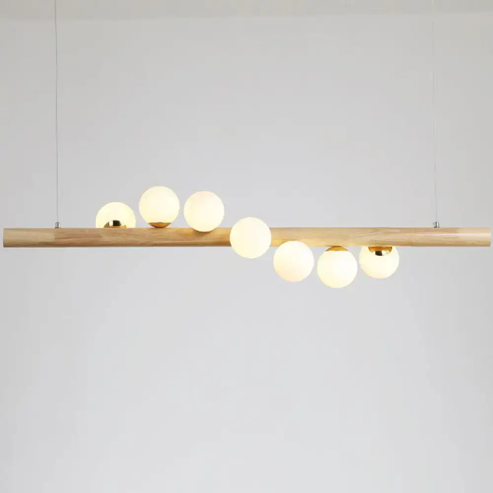 DecorBites™ minimalistic milk glass suspension light with natural wood bar and six frosted globes for dining room