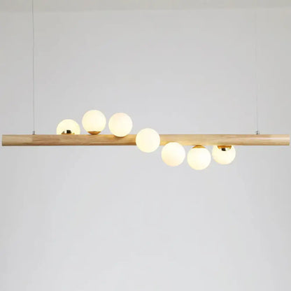 DecorBites™ minimalistic milk glass suspension light with natural wood bar and six frosted globes for dining room