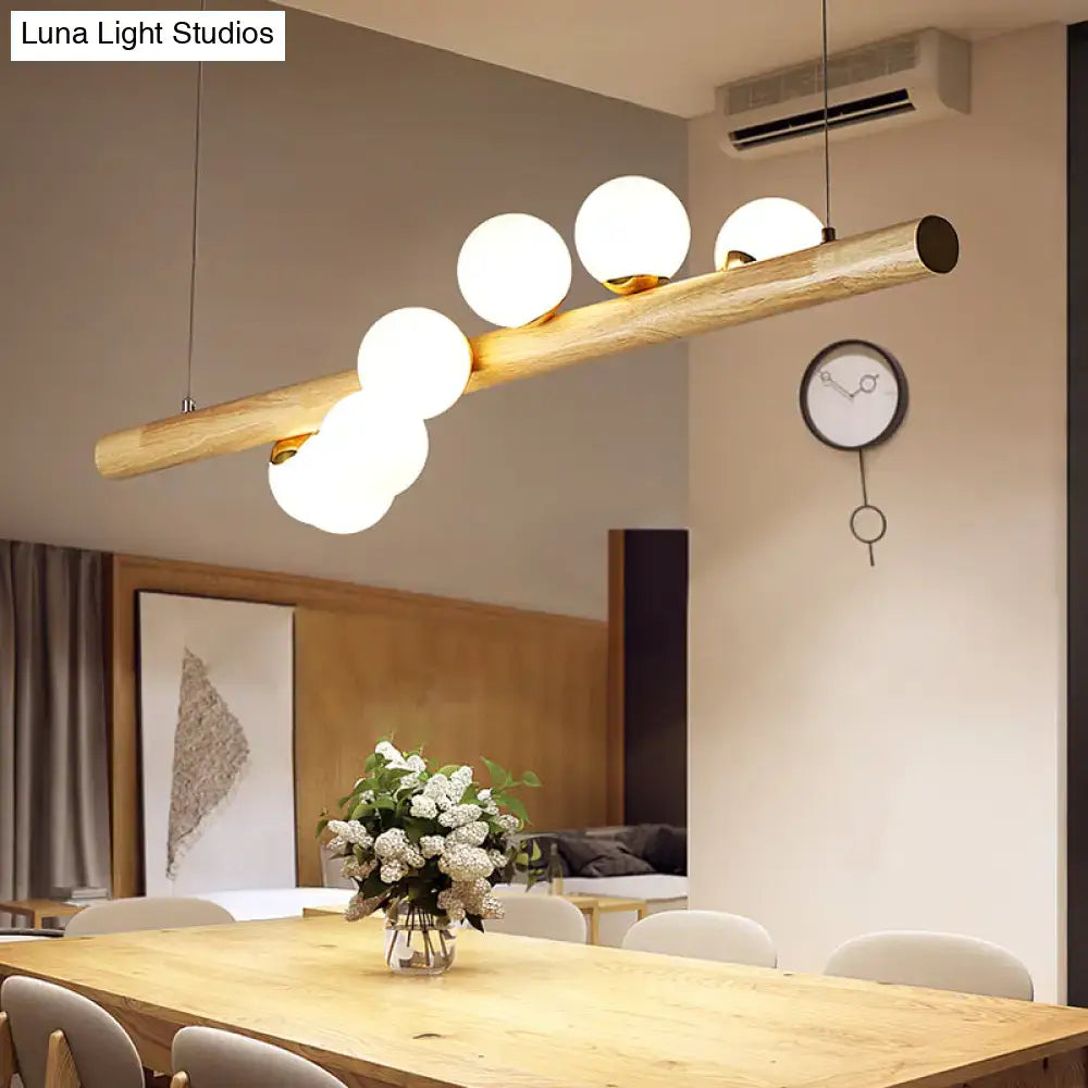 Decorbites™ minimalistic milk glass suspension light with natural wood finish and five frosted globes for dining room