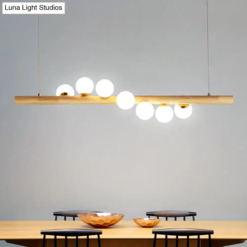 Decorbites™ minimalistic milk glass suspension light with wooden bar and white globes for dining room suspension light