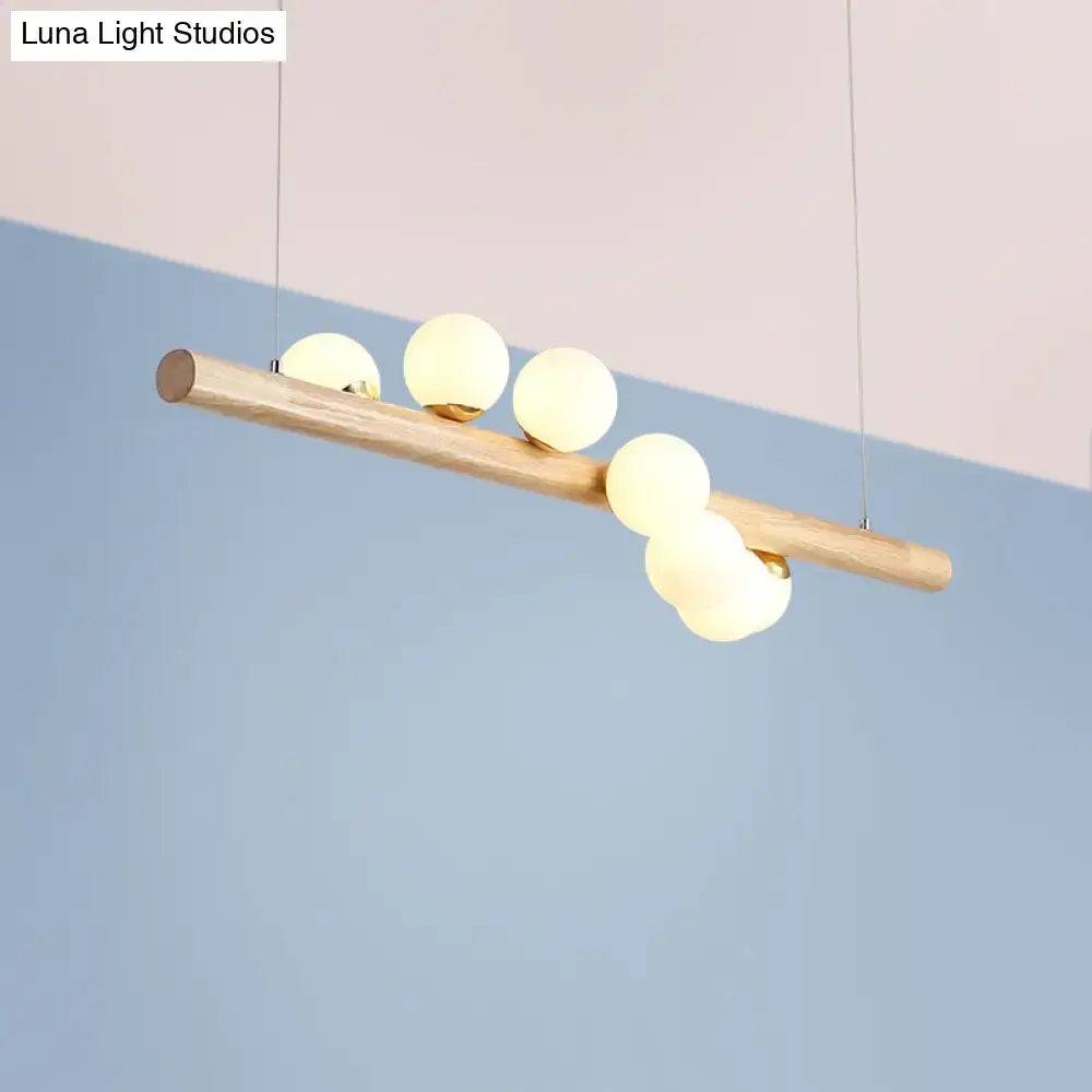 DecorBites™ milk glass suspension light with natural wood beam and five frosted globes for dining room suspension light