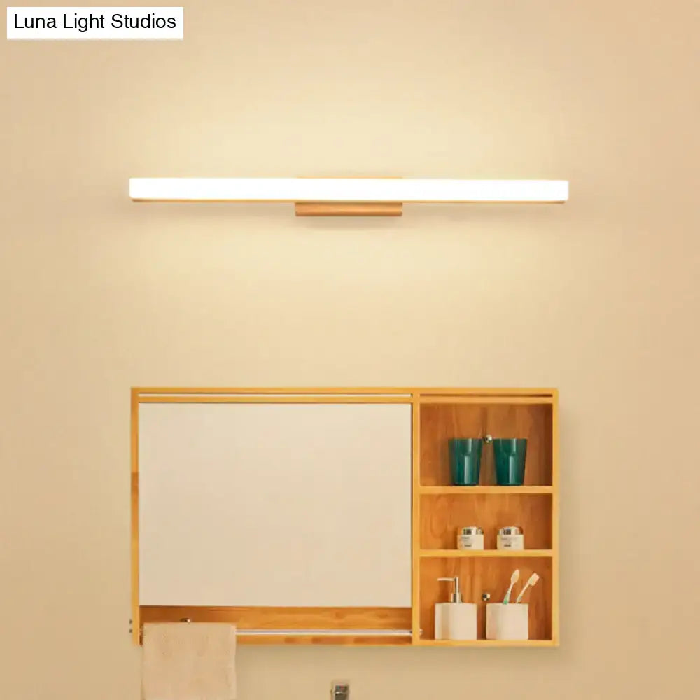 Minimalist led wall light with warm white glow and slender wooden base for modern bathroom vanity use