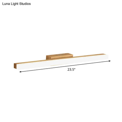 Modern wood and gold led wall vanity light with a white rectangular body and natural wood accents for bathroom use