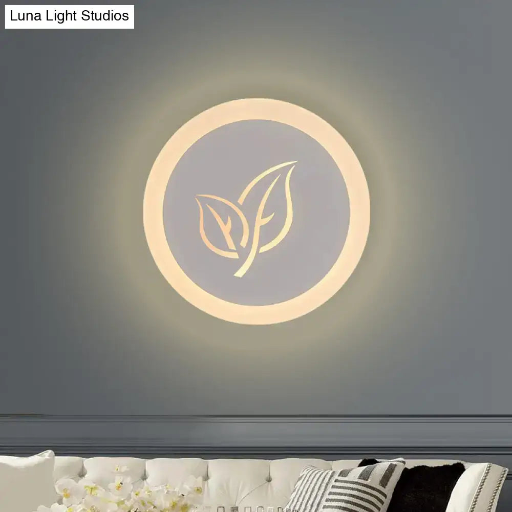 Modern wood and gray leaf wall lamp with warm glow and gold leaf design on matte gray circular face for bedroom use