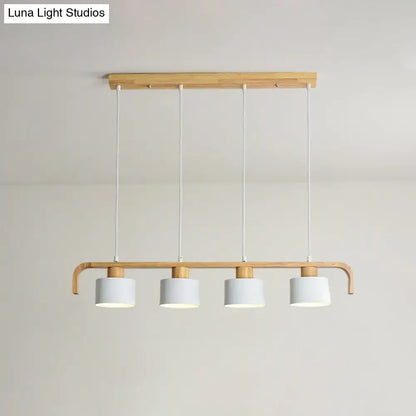 Minimalist modern wood pendant light with four white cylindrical shades for dining room kitchen LED incandescent fluorescent use