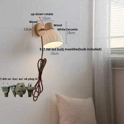 Modern wall light fixture with wooden base and white ceramic shade featuring adjustable design for versatile lighting