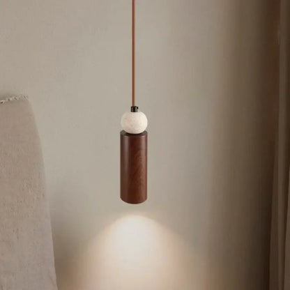 Minimalist decorbites iron led pendant light with dark wood cylindrical body and white textured spherical top for living room