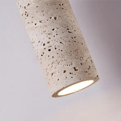 Modern wood and travertine led wall lamp with cylindrical concrete pendant and warm speckled textured glow