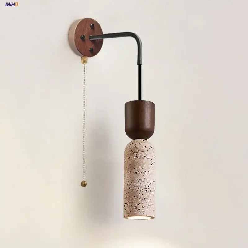 Modern wood and travertine led wall lamp with dark wood base, black metal arm, and textured beige concrete shade for bedroom sconce