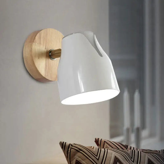 Modern wood and white ceramic wall light with natural wood backplate and brass metallic bud shade light source