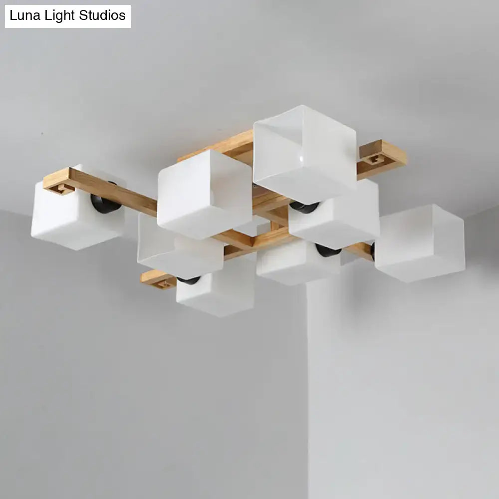 Modern ceiling light fixture featuring white glass cubes and a wood canopy for stylish living room lighting