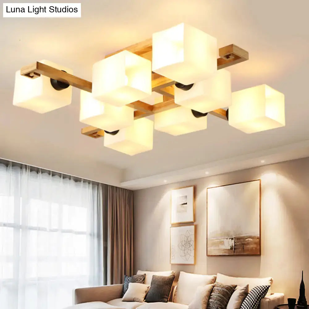 Modern rectangular ceiling light fixture featuring white glass cubes on a wood canopy for living room lighting