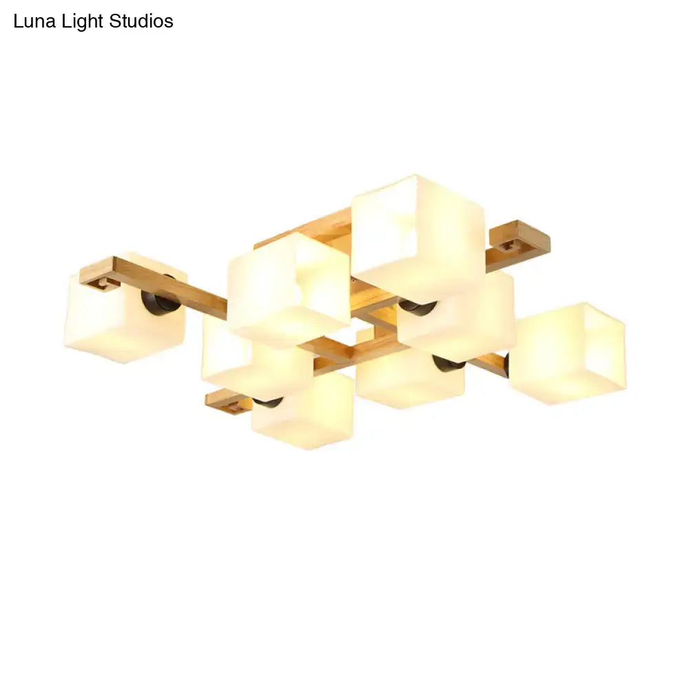 Modern geometric ceiling light with warm frosted white glass cubes and wood canopy for living room lighting by DecorBites™