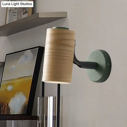 Modern wood and yellow green wall sconce pair featuring cylindrical wooden shade and matte green blue metal base for bathroom
