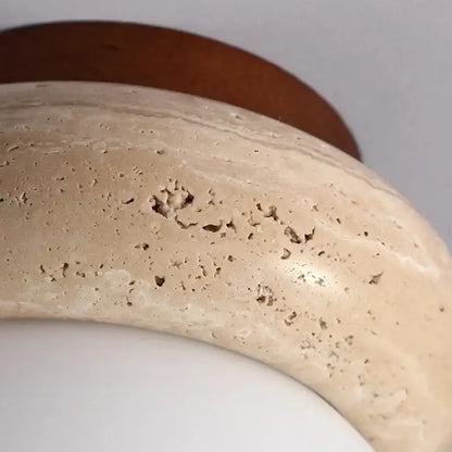 Beige stone bowl ceiling light with smooth textured surface and natural veins on modern wood base decorbites led ceiling